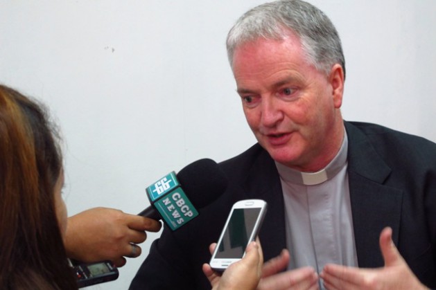 <p>Vatican official Msgr. Paul Tighe speaks to reporters in Manila on Thursday</p>