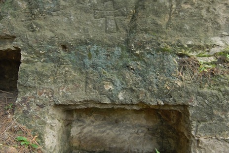 <p>The carved Nestorian cross can be seen above the niche, indicating that this was an early burial place for Christians </p>