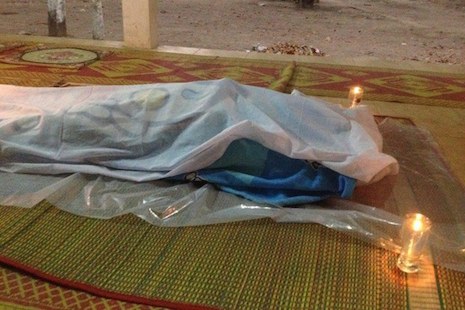 <p>The body of CNRP activist Bun Borin lies in repose at his funeral in Banteay Meanchey province on Monday (Credit: RFA)</p>