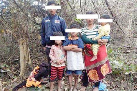 <p>An ethnic Montagnard family poses for a photograph in Cambodia’s Ratanakkiri province in January after fleeing persecution in Vietnam. The family were later arrested and deported by Cambodian authorities (Credit: ADHOC)</p>