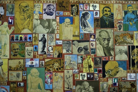 <p>Various images of Mahatma Gandhi make up a hand-made collage featured in the reception area at the Gandhi Peace Foundation in New Delhi on Sept. 8. (Photo by Chandan Khanna/AFP)</p>