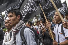Militants, opposition unite to attack Indonesia's Widodo