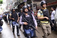 Twelve militants charged over Catholic shopkeeper killing 