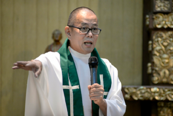 Priest critic of Duterte accuses police of spying on him