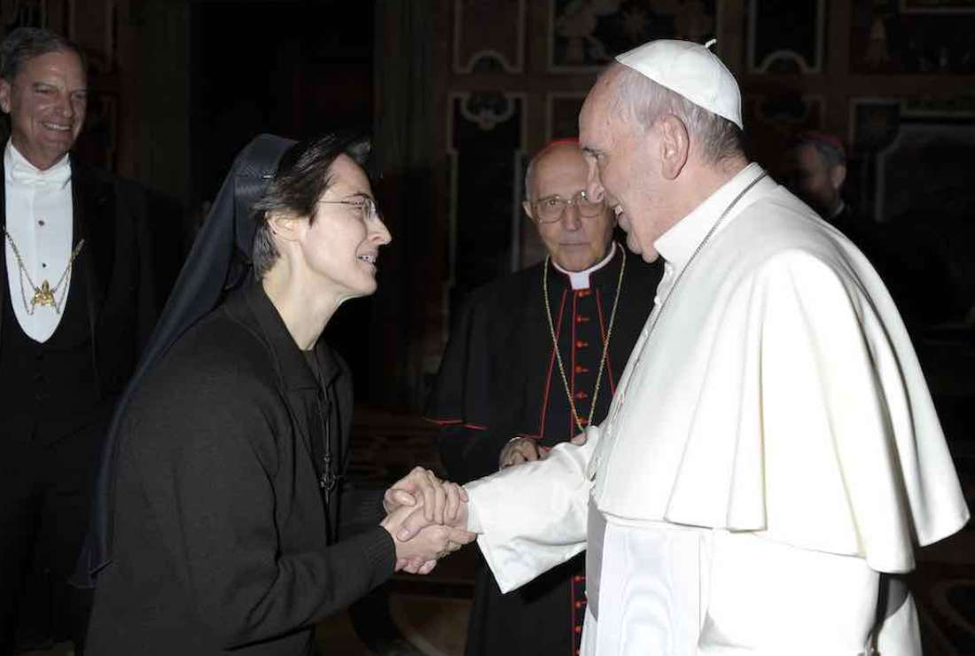 This handout picture released on Nov 5, 2021 by Vatican Media shows Pope Francis greeting Franciscan sister Raffaella Petrini, who was appointed on Nov 4, 2021 as the new secretary-general of the governorate, making her the first woman to ever hold the post