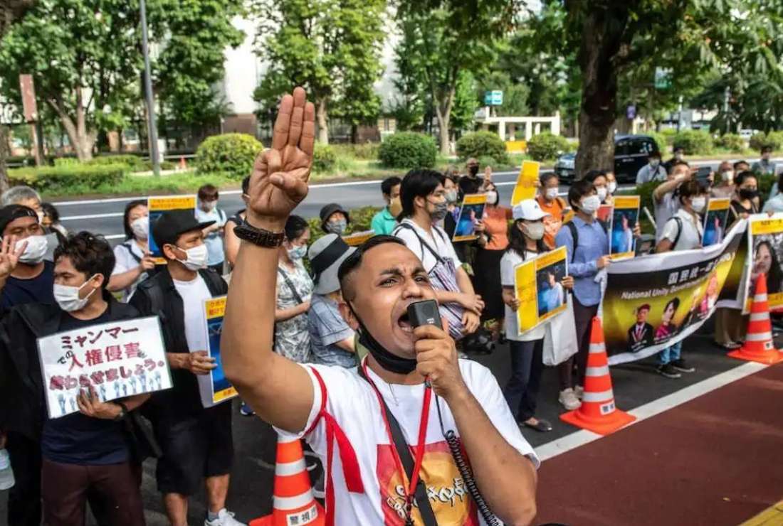 A group of activists shouts slogans demanding to free Japanese citizen Toru Kubota, who is detained in Myanmar, during a rally in front of the Ministry of Foreign Affairs in Tokyo on July 31