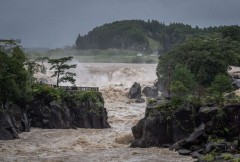 One killed as another typhoon nears Japan