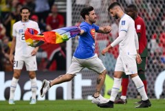 Man with rainbow flag invades FIFA World Cup match