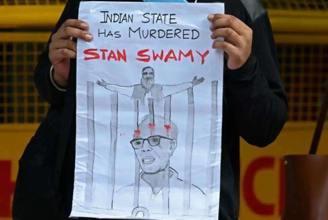 A student takes part in a demonstration in New Delhi on July 6, 2021, after the Indian rights activist and Jesuit priest Father Stan Swamy, who was detained for nine months without trial under Indian anti-terrorism laws died on July 5 ahead of a bail hearing, officials said