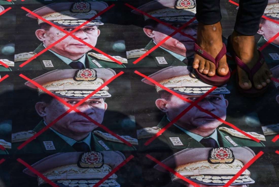 In this file photo taken on March 5, 2021, a protester steps on portraits of Myanmar's armed forces chief Senior General Min Aung Hlaing placed on a street during a demonstration against the military coup in Yangon. Myanmar's military seized power on Feb 1, 2021, ousting the civilian government and arresting its de facto leader, Aung San Suu Kyi. More than 2,800 people have since been killed, according to the United Nations, and thousands more have been arrested as the junta wages a bloody crackdown on dissent