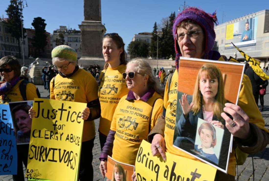 Members of Ending Clergy Abuse (ECA), a global organization of prominent survivors and activists in Rome for a papal summit, display photos of Barbara Blaine, the late founder and president of Survivors Network of those Abused by Priests (SNAP), during a protest of abuse victims on Piazza del Popolo in Rome on Feb. 23, 2019