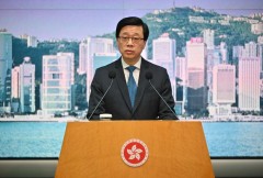 HK leader calls 8 activists to give up or live 'in fear'