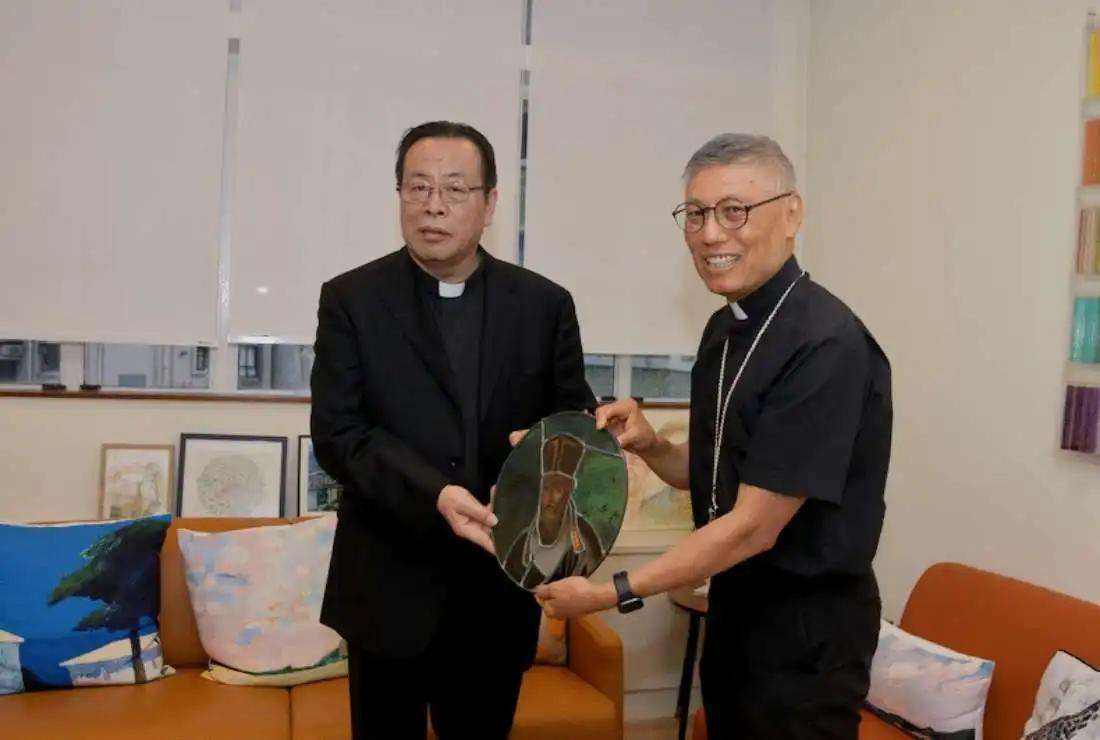  Archbishop Joseph Li Shan of Beijing (left) hands over an image of pioneering Italian Jesuit missionary Matteo Ricci to Cardinal Stephen Chow of Hong Kong on Nov. 13