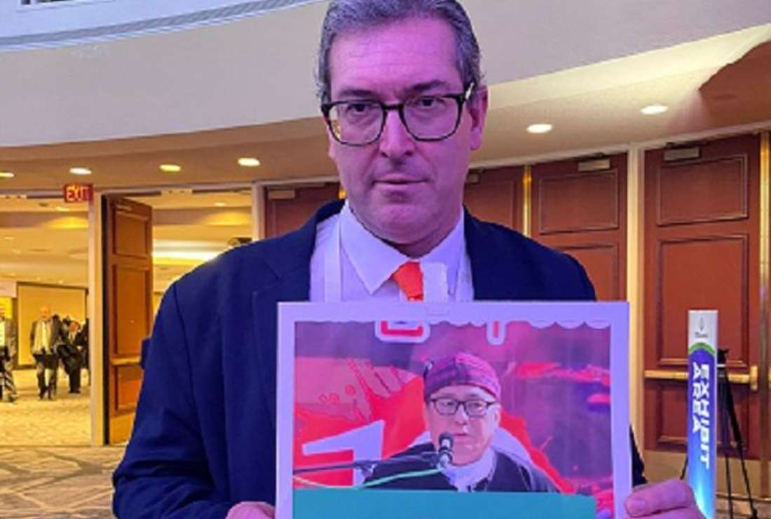 Benedict Rogers with a photograph of Reverend Dr. Hkalam Samson, former president of the Kachin Baptist Convention in Myanmar, at the International Religious Freedom (IRF) Summit in Washington, D.C. (Photo supplied)