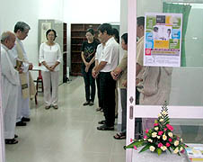 Redemptorists and lay Catholics pray at the opening of the counseling office on July 31