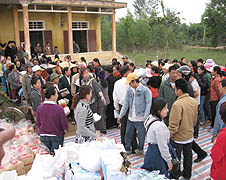 People from Trung Quan parish in Quang Binh province gather to receive supplies
